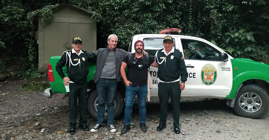 Tourists posing with the tourist police in Peru