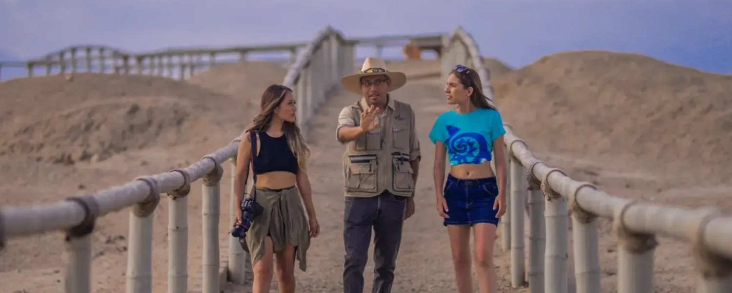 Travelers in huaca cao viejo peru