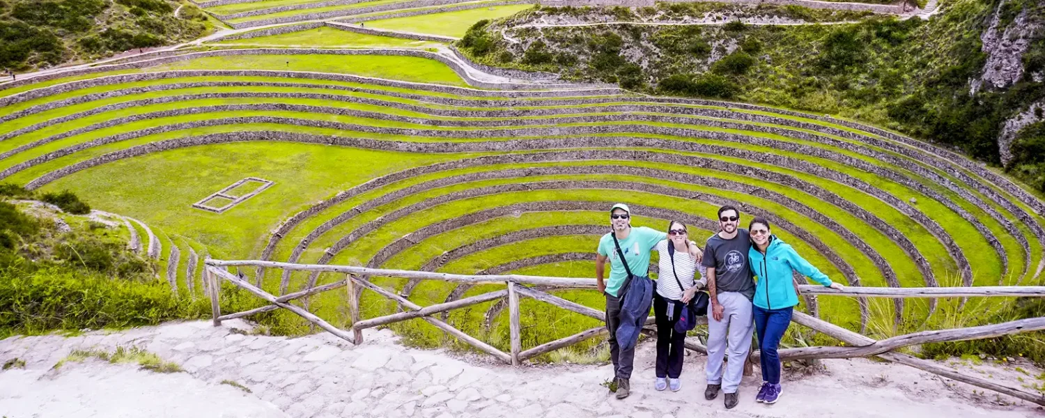Family travelers in Moray ruins peru