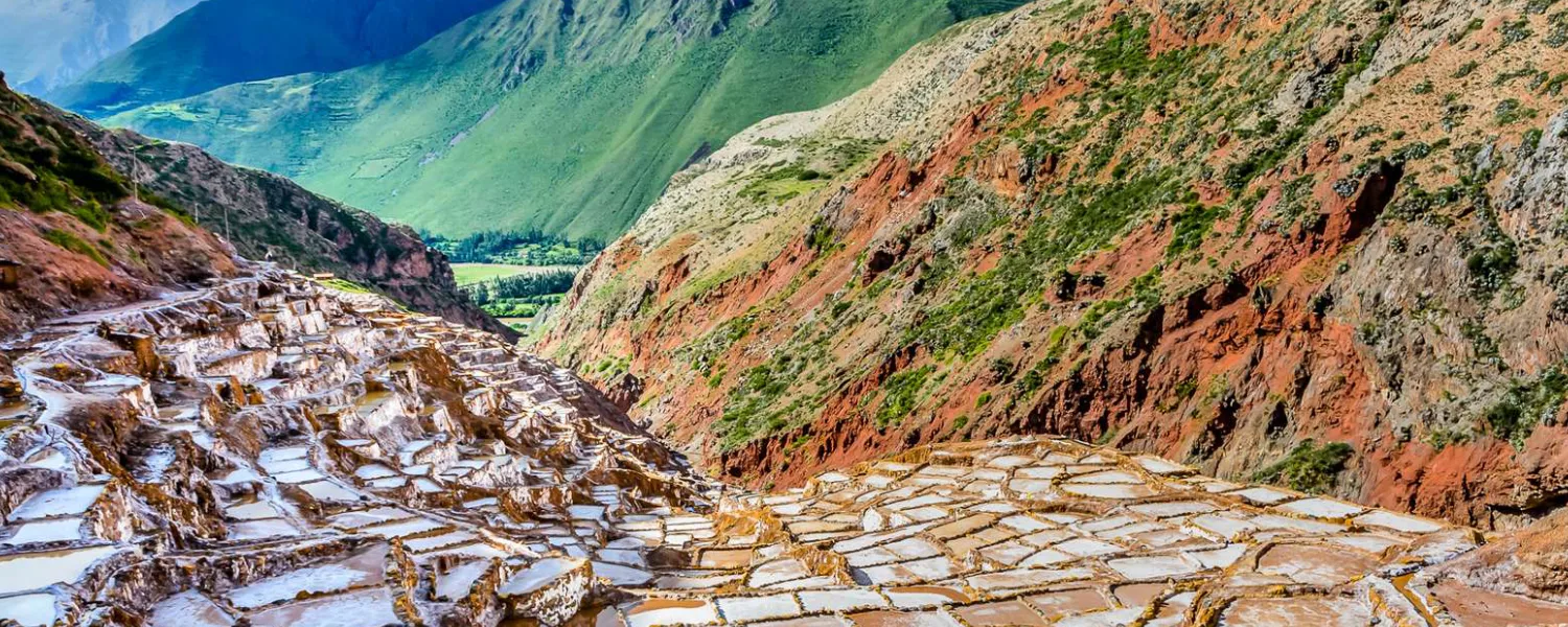 Maras Salineras displaying an expansive network of white salt-drying terraces.
