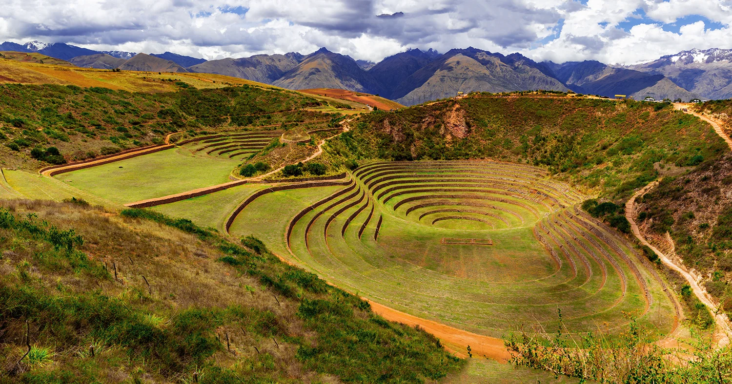 Panoramic view of the circular Inca agricultural terraces at Moray archaeological site near Cusco, Peru
