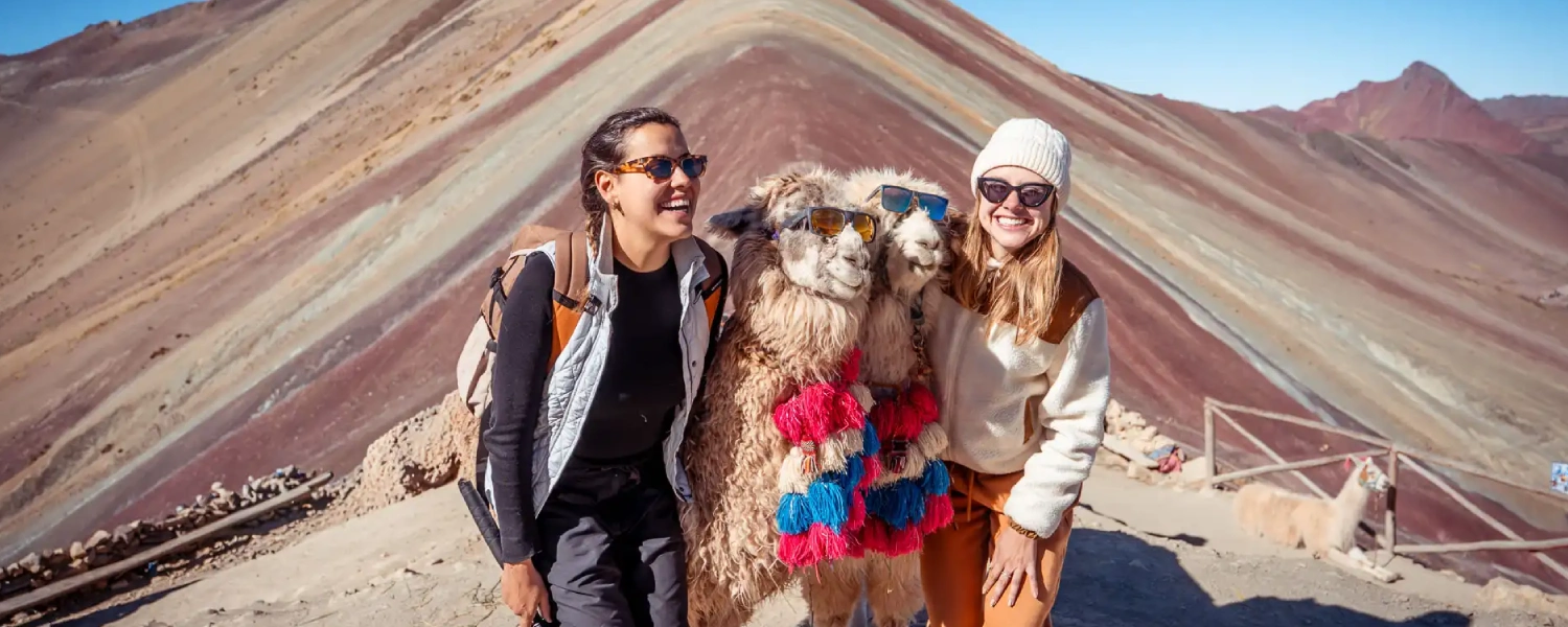 Tourists exploring the 7 Color Mountain in Cusco with the Peru Grand Travel (PGT) team.