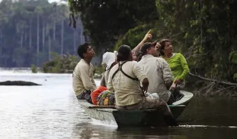 Lago Sandoval showing tourists exploring the lush Amazon rainforest.