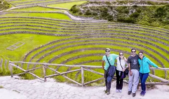 Family travelers in Moray ruins peru