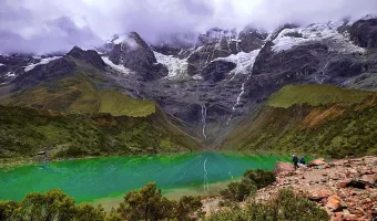 Humantay Lake surrounded by snow-capped mountains near Cusco, Peru