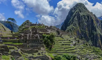 Machu Picchu Inca citadel surrounded by mountains in Peru