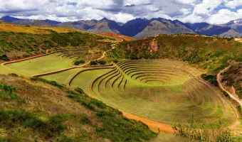 Panoramic view of the circular Inca agricultural terraces at Moray archaeological site near Cusco, Peru