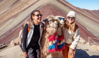 Tourists exploring the 7 Color Mountain in Cusco with the Peru Grand Travel (PGT) team.