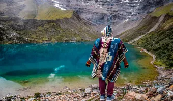 Turquoise Humantay Lake surrounded by snow-capped mountains near Cusco, Peru