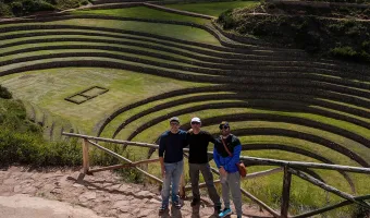 Travelers visiting the Inca terraces of Moray in Peru