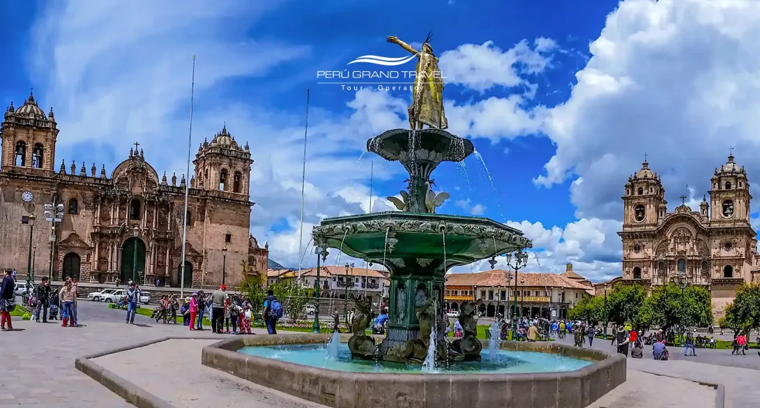 Half-Day Tours in Peru in Cusco, featuring the Plaza de Armas with the historic fountain, Cusco Cathedral, and colonial architecture under a blue sky