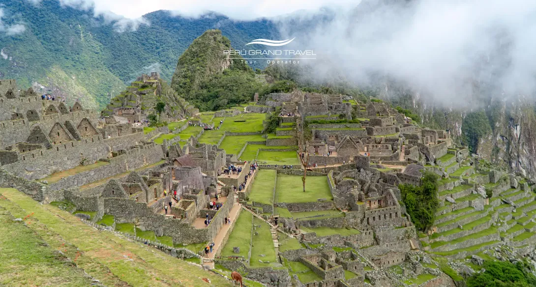 Panoramic view of Machu Picchu showing Inca terraces and stone structures in the Andes